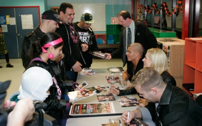 13-_The_Hart_Dynasty_signs_autographs_for_partygoers_at_the_fundraiser.jpg
